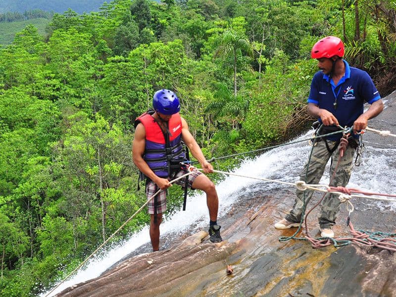 The tourist get experience of the abseiling with the well guidance in Kithulgala tour Sri Lanka