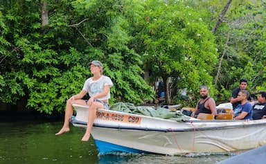 Tourists enjoining their boat ride with Bird Watching in Negombo Sri Lanka