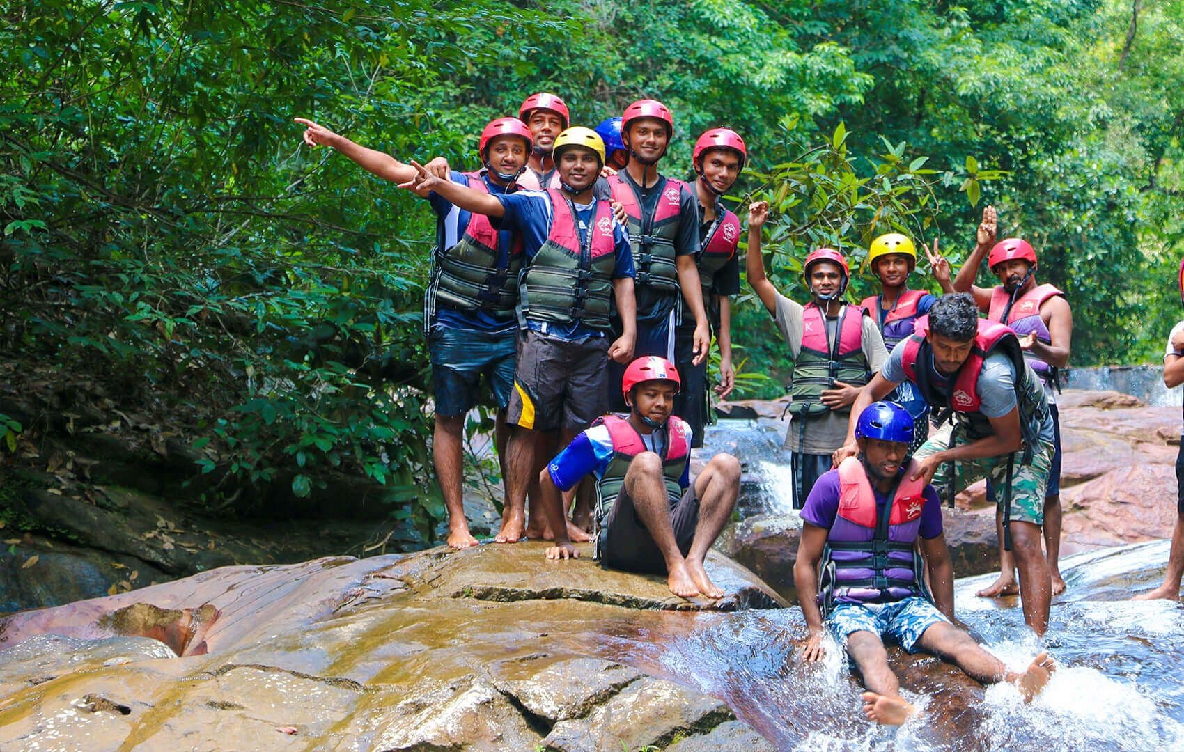 A guide give guidance to canyoning group in Kithulgala Sri Lanka
