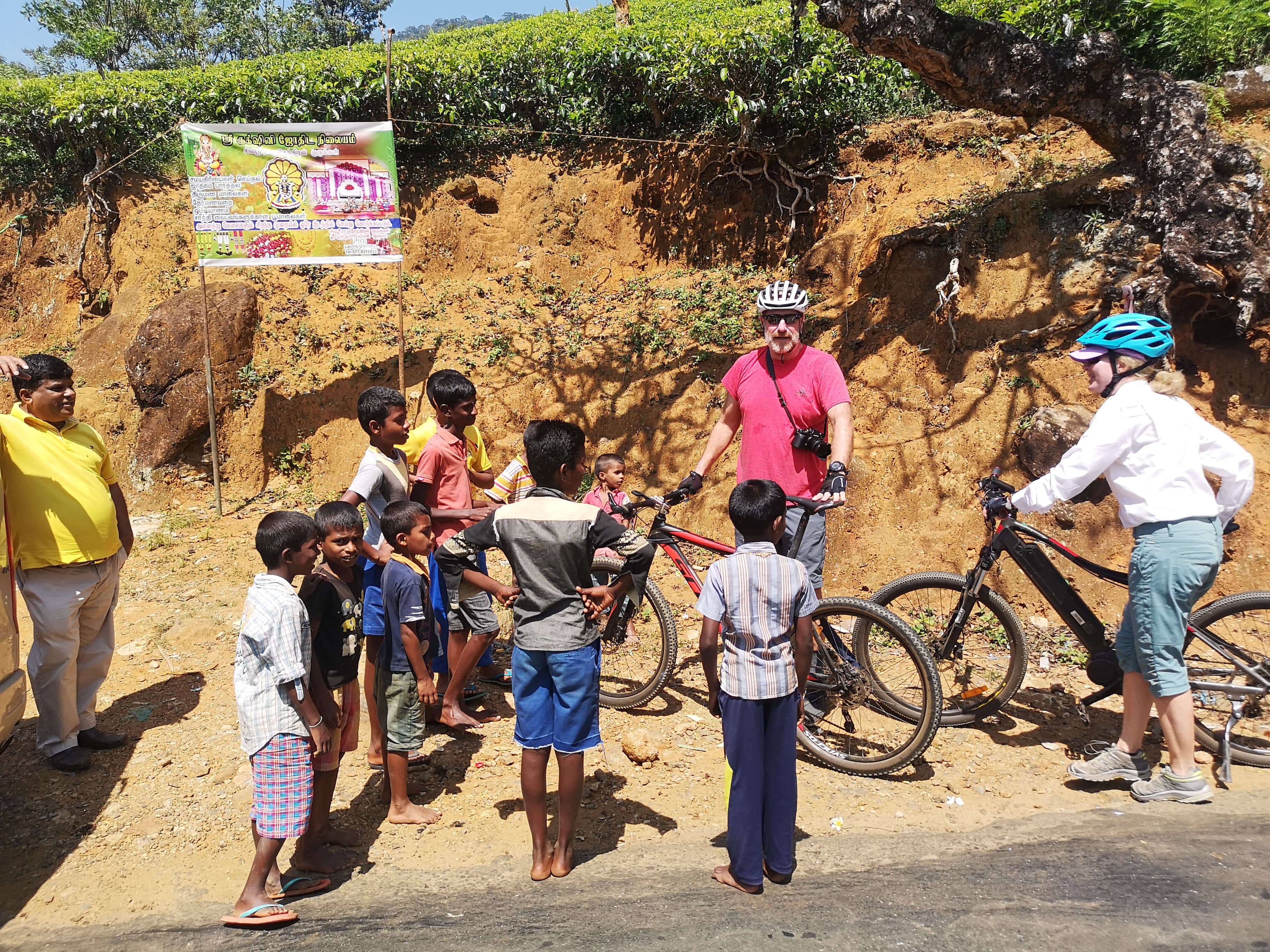 Cyclists meet people in cycling tour Kandy to Nuwara Eliya Sri Lanka