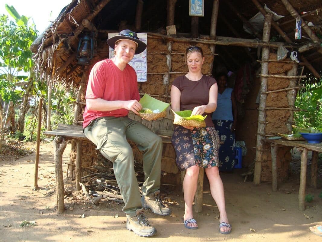 A couple of tourists experiencing the natives’ living style while Ella to Udawalawe cycle tour in Sri Lanka