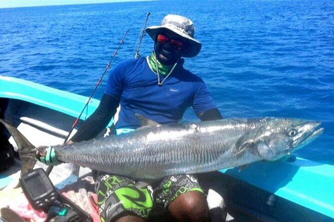 The tourist catch a mackerel fish in the Hikkaduwa fishing spot Sri Lanka
