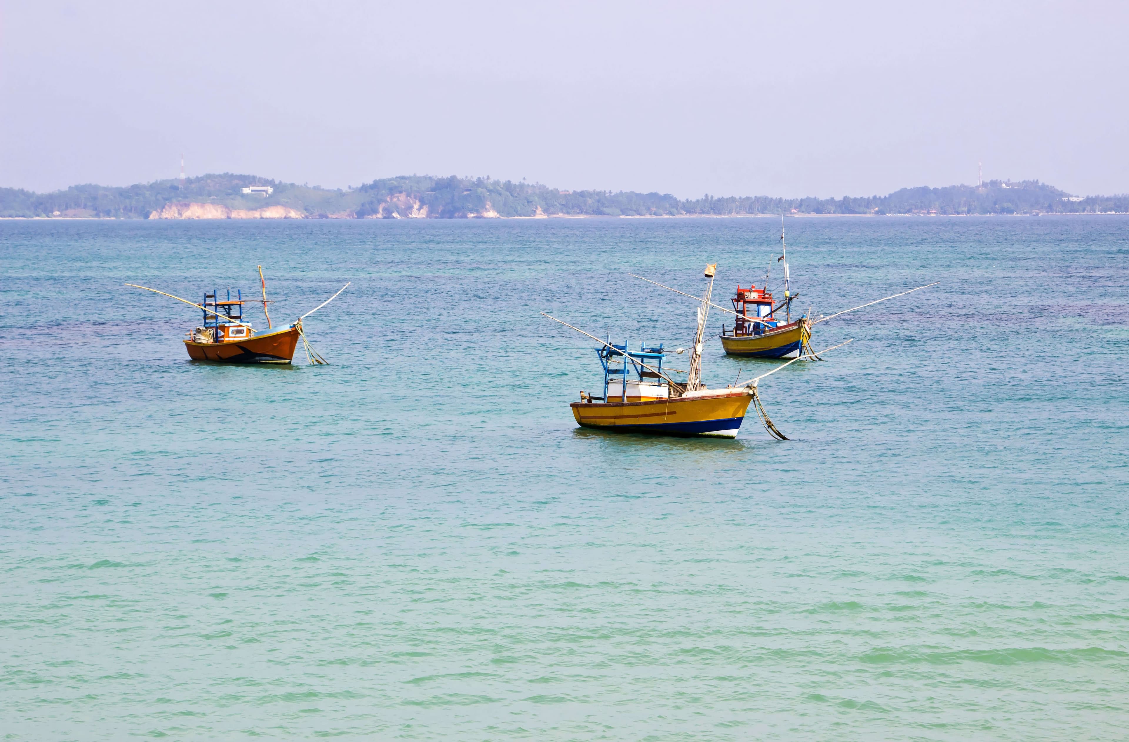 View of fishing boats on the sea in Hikkaduwa Sri Lanka