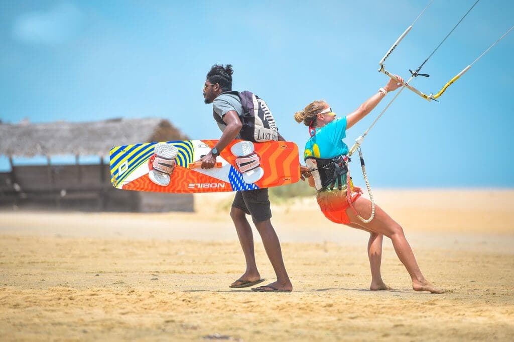 A picture of giving basic training to a woman before Kite Surfing Sri Lanka