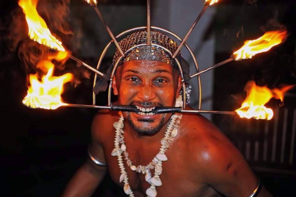 A fire dance performer in a Perahara festival, Sri Lanka.