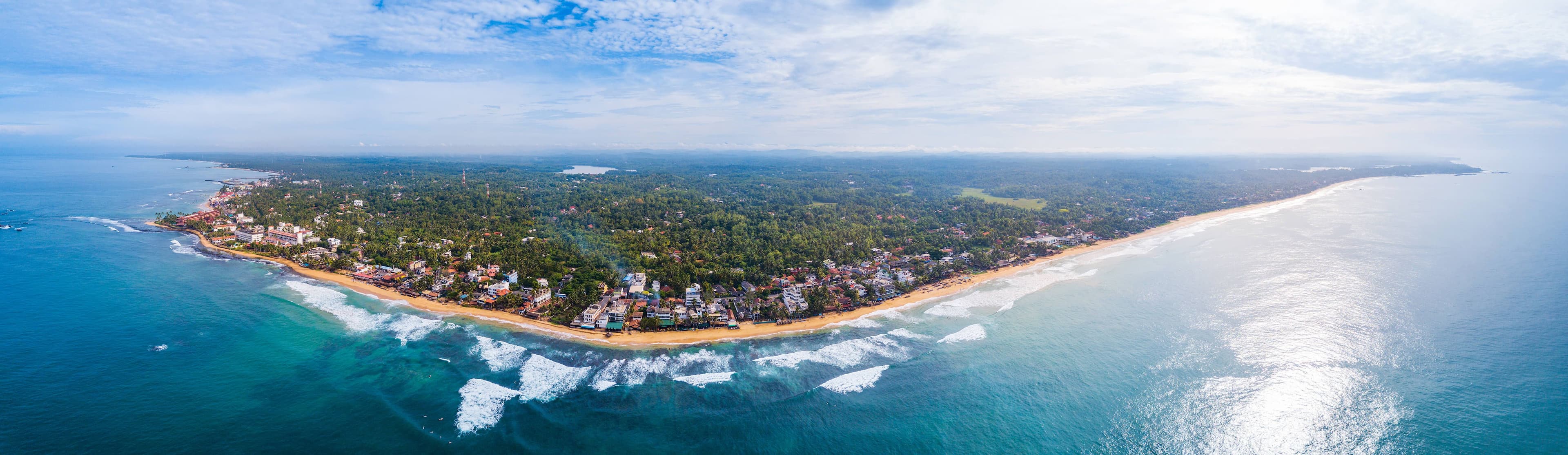 Aerial view of the town of Hikkaduwa with its beaches, Sri Lanka.