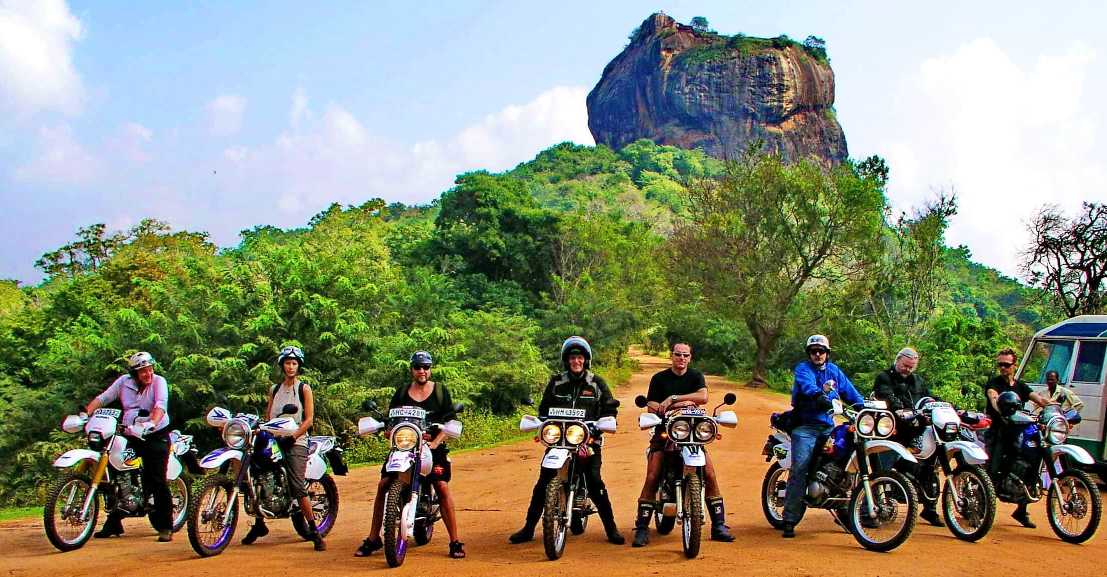 A group of bikers near the Lion's Rock during a motorcycle tour, Sigiriya, Sri Lanka.