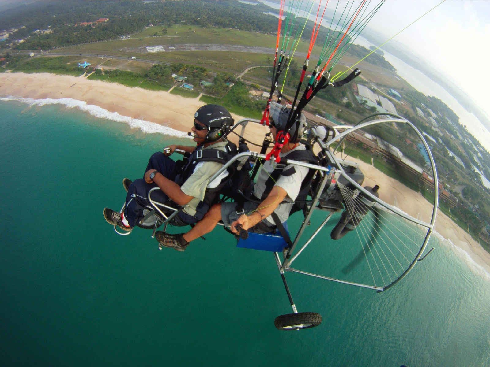 The men fly like a bird in Bentota coast and experience inland, coastal landscapes in bird eye